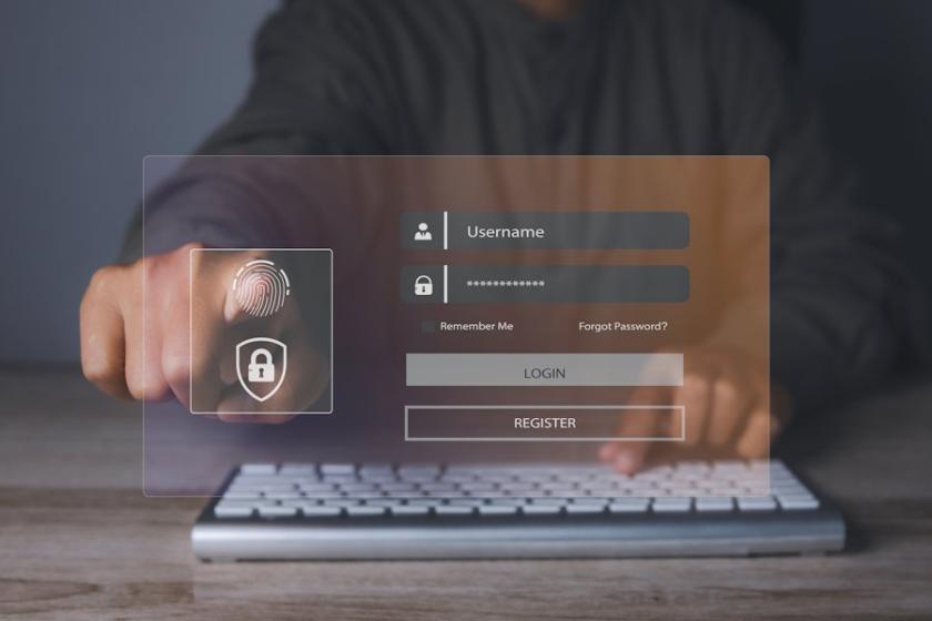Person tippt auf ein virtuelles Login-Fenster mit Fingerabdrucksymbol über einer Tastatur – Symbolbild für sichere automatische Anmeldung und Sperrbildschirm unter Linux. (Quelle: nuruddean – 123RF)